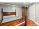 Basement bedroom with a vintage metal frame bed near a closet and the hallway door at 2106 4Th Ne St, Hickory, NC 28601