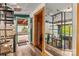 Hallway with modern decor, an eclectic staircase, and access to the covered patio at 2106 4Th Ne St, Hickory, NC 28601