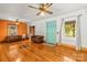 Open concept living room with hardwood floors, a teal front door, and abundant natural light at 2106 4Th Ne St, Hickory, NC 28601