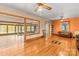 A spacious living room with hardwood floors, exposed beams, and large windows offering lots of natural light at 2106 4Th Ne St, Hickory, NC 28601