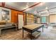 Explore the studio with brick floors, functional tables, and convenient shelving, offering an environment designed for creativity at 2106 4Th Ne St, Hickory, NC 28601