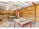 Inside the studio, discover wood floors and walls, plus adjustable shelving and versatile tables, creating a workspace ready for your creativity at 2106 4Th Ne St, Hickory, NC 28601