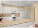 Kitchen with granite counters, white cabinets, and stainless steel appliances at 213 Walnut Point Dr, Matthews, NC 28105