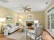 Cozy living room featuring a fireplace, neutral decor, and plenty of natural light at 213 Walnut Point Dr, Matthews, NC 28105