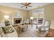 Comfortable living room with fireplace and access to a deck through glass doors at 213 Walnut Point Dr, Matthews, NC 28105