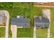 Aerial view of properties showcasing lush lawns, mature landscaping, and well-maintained roofs in a neighborhood at 2459 Glenridge Dr, Gastonia, NC 28054