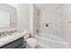 Bathroom features bathtub with marble tiling, updated fixtures, and stylish vanity at 2459 Glenridge Dr, Gastonia, NC 28054