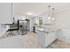 Modern kitchen boasts white cabinets, granite countertops, stainless steel appliances and plank flooring at 2459 Glenridge Dr, Gastonia, NC 28054