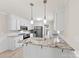 Bright kitchen features granite countertops, stainless steel appliances, and a breakfast bar at 2459 Glenridge Dr, Gastonia, NC 28054