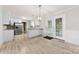 Open kitchen and dining area filled with natural light from the adjacent backyard access at 2459 Glenridge Dr, Gastonia, NC 28054