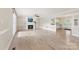 Spacious living room with a cozy fireplace and ample natural light from large windows at 2459 Glenridge Dr, Gastonia, NC 28054