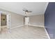 Main bedroom with ceiling fan and view of ensuite bathroom and walk in closet at 2459 Glenridge Dr, Gastonia, NC 28054