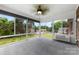 Bright sunroom featuring large windows with backyard views, ceiling fan, and comfortable space to relax at 2459 Glenridge Dr, Gastonia, NC 28054
