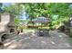 Backyard features an outdoor fireplace and patio seating area at 2729 Clemson Ave, Charlotte, NC 28205
