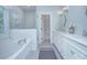 Luxurious bathroom with marble shower, soaker tub, and double sink vanity at 2729 Clemson Ave, Charlotte, NC 28205