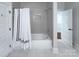 Bathroom with subway tile, shower/tub combo, and shower curtain at 2729 Clemson Ave, Charlotte, NC 28205