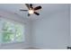 Bedroom with carpet, baseboard, and one large window with natural light and a ceiling fan at 2729 Clemson Ave, Charlotte, NC 28205