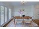 Dining room with decorative rug, modern chandelier, and a rectangular wooden table with seating for six at 2729 Clemson Ave, Charlotte, NC 28205