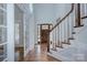 Foyer with hardwood floors, grand staircase, and an elegant front door at 2729 Clemson Ave, Charlotte, NC 28205