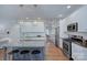Bright, open kitchen with granite counters, stainless steel appliances, and island seating offers modern convenience at 2729 Clemson Ave, Charlotte, NC 28205