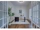 Office space with hardwood floors, large windows, a modern desk, and ample natural light at 2729 Clemson Ave, Charlotte, NC 28205