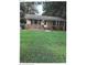 Charming single-story home with brick and siding exterior, and a large front yard at 2831 Denview Ln, Charlotte, NC 28208
