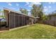 A well-manicured lawn and screened porch extends the living space outdoors at 3036 Palm Ave, Charlotte, NC 28205