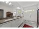 Bright bathroom with double sinks, modern lighting, and an open shower with a glass door at 3036 Palm Ave, Charlotte, NC 28205