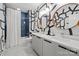Modern bathroom with a double sink vanity, unique wallpaper, and stylish fixtures at 3036 Palm Ave, Charlotte, NC 28205