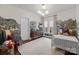 Cozy bedroom featuring charming decor, natural light, and a comfortable atmosphere at 3036 Palm Ave, Charlotte, NC 28205