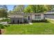 Landscaped front yard with modern exterior and inviting entrance at 3036 Palm Ave, Charlotte, NC 28205