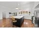Gourmet kitchen featuring a large island, stainless steel appliances, and stylish pendant lighting at 3036 Palm Ave, Charlotte, NC 28205