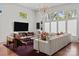 Bright and airy living room featuring a sleek entertainment center and comfortable seating with a modern aesthetic at 3036 Palm Ave, Charlotte, NC 28205