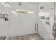 Modern shower with glass enclosure, sleek fixtures, and a unique tiled floor at 3036 Palm Ave, Charlotte, NC 28205