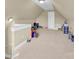 Spacious carpeted attic with finished walls, a door, and ample storage or play area at 3068 Green Acres Ln, Claremont, NC 28610