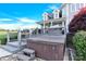 Relaxing hot tub in a serene backyard setting with lush landscaping and a charming two-story home at 3068 Green Acres Ln, Claremont, NC 28610