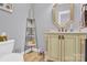 Bright powder room featuring a decorative vanity, tile flooring, and updated fixtures at 3068 Green Acres Ln, Claremont, NC 28610