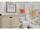 Cozy bathroom featuring a vanity with a mirror, toilet, and floral patterned shower curtain at 3068 Green Acres Ln, Claremont, NC 28610