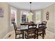 Traditional dining room features a large bay window and dining table with seating for six at 3068 Green Acres Ln, Claremont, NC 28610
