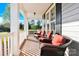 Relaxing front porch with comfortable seating and charming architectural details for outdoor enjoyment at 3068 Green Acres Ln, Claremont, NC 28610