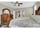 Spacious main bedroom with wood floors, ceiling fan, ensuite bath, and ample natural light at 3068 Green Acres Ln, Claremont, NC 28610