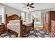 Spacious main bedroom with wood floors, ceiling fan, and ample natural light at 3068 Green Acres Ln, Claremont, NC 28610