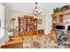 Classic home office featuring custom built-in bookshelves, a large desk, and hardwood floors at 3068 Green Acres Ln, Claremont, NC 28610