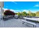 An outdoor deck offering a spacious area for dining and entertaining, complete with a grill and seating at 3068 Green Acres Ln, Claremont, NC 28610
