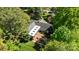 Aerial view showcasing the home's expansive lot, beautiful landscaping, covered patio, and outdoor living spaces at 311 Mcalway Rd, Charlotte, NC 28211
