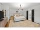 This bedroom offers a light-filled space, neutral tones, and an ensuite bath for added comfort and convenience at 311 Mcalway Rd, Charlotte, NC 28211