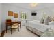 Inviting bedroom with two bright windows, a comfortable bed, and a quaint writing desk at 311 Mcalway Rd, Charlotte, NC 28211