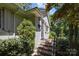 Inviting front entrance featuring brick steps, stylish lighting, and mature landscaping for added curb appeal at 311 Mcalway Rd, Charlotte, NC 28211