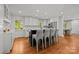 Open concept kitchen with stainless steel appliances, island, and hardwood floors at 311 Mcalway Rd, Charlotte, NC 28211