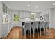 Bright eat-in kitchen with a marble topped island and bar stool seating at 311 Mcalway Rd, Charlotte, NC 28211